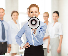 Image showing happy woman with megaphone