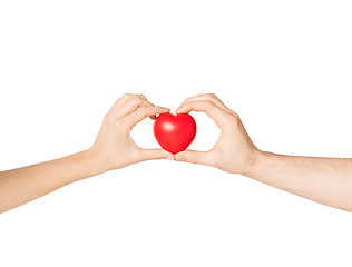 Image showing woman and man hands with heart