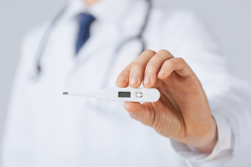 Image showing male doctor with thermometer