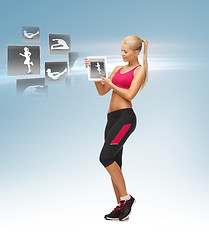 Image showing woman holding tablet pc with sport application