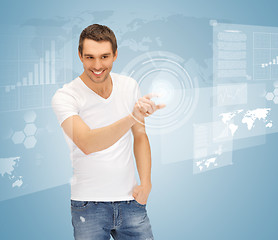 Image showing man touching virtual screen