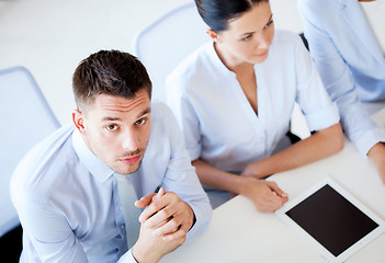 Image showing serious businessman on meeting in office