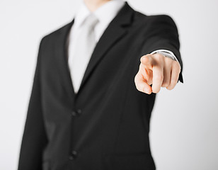 Image showing man pointing his finger at you