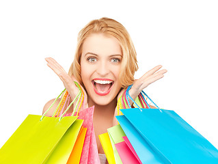 Image showing excited woman with shopping bags