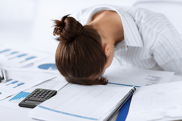 Image showing woman sleeping at work in funny pose