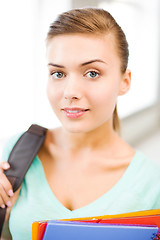 Image showing student girl with school bag and color folders