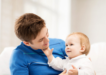 Image showing happy father with adorable baby