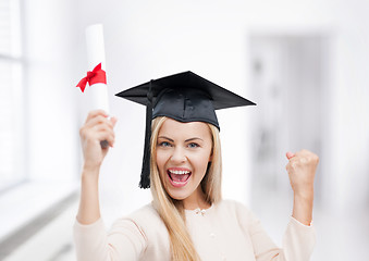 Image showing student in graduation cap with certificate