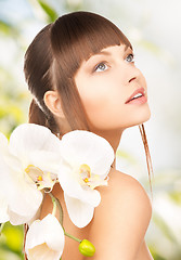 Image showing beautiful woman with orchid flower