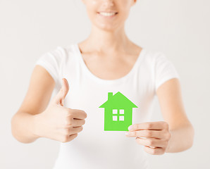 Image showing woman hands holding green house