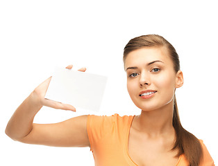 Image showing smiling woman holding white blank card