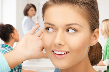 Image showing student girl listening gossip at school