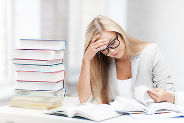 Image showing student with books and notes