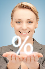 Image showing woman showing sign of percent in her hands