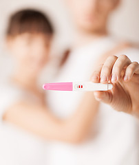 Image showing woman and man hands with pregnancy test