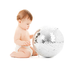 Image showing child playing with disco ball