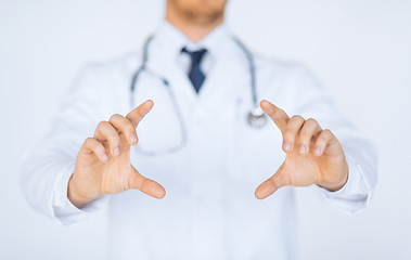 Image showing doctor with holding something with hands