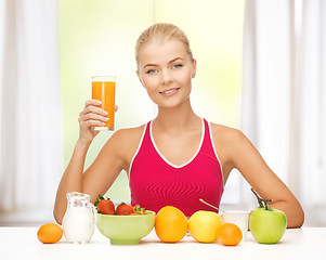 Image showing young woman eating healthy breakfast