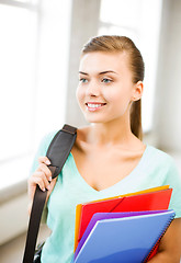 Image showing student girl with school bag and color folders