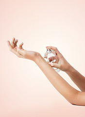 Image showing woman hands spraying perfume