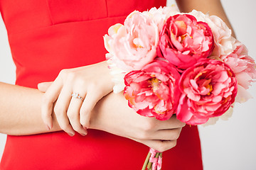 Image showing woman hands with flowers and ring