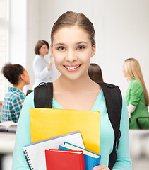 Image showing student girl with school bag and notebooks