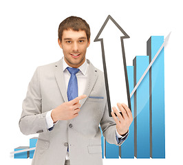 Image showing businessman with arrow and 3d chart