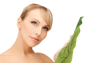 Image showing woman with green leaf