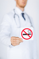 Image showing male doctor holding no smoking sign