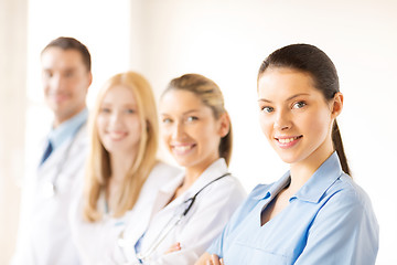 Image showing female doctor in front of medical group