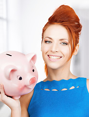 Image showing lovely woman with big piggy bank