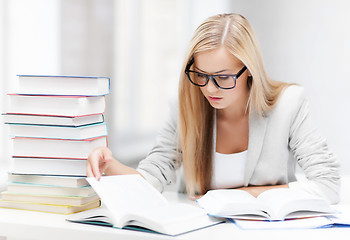 Image showing student with books and notes