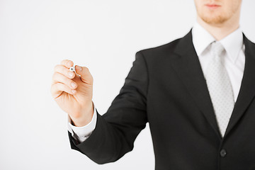 Image showing man writing something in the air