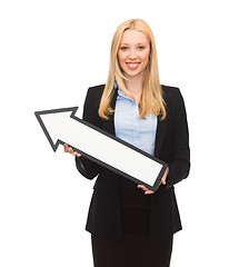 Image showing smiling businesswoman with direction arrow sign