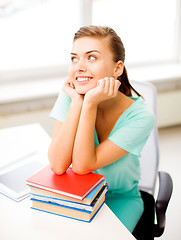 Image showing happy smiling student girl with books