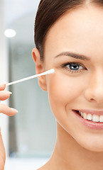 Image showing beautiful woman with cotton bud