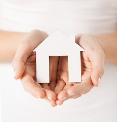 Image showing woman hands holding paper house