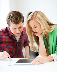 Image showing students looking at tablet pc at school