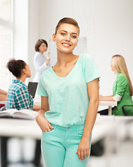 Image showing smiling girl in color t-shirt at school