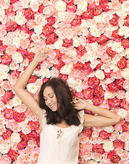 Image showing beautiful woman and background full of roses