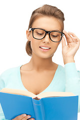 Image showing woman in glasses reading book