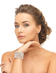 Image showing woman with pearl earrings and bracelet