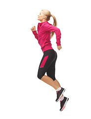 Image showing sporty woman running or jumping