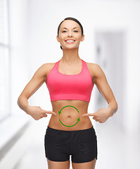 Image showing woman with arrows on her stomach