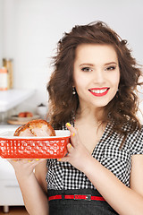 Image showing lovely housewife with meat