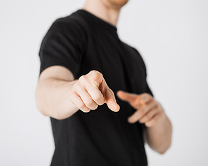 Image showing man pointing his finger at you