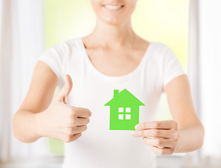 Image showing woman hands holding green house