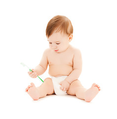 Image showing curious baby brushing teeth