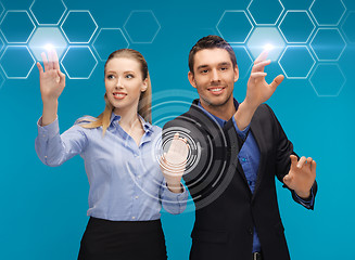 Image showing man and woman working with virtual screen