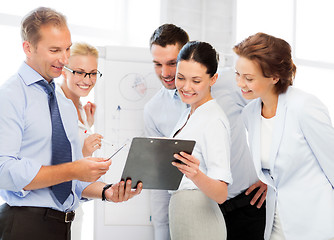 Image showing business team discussing something in office